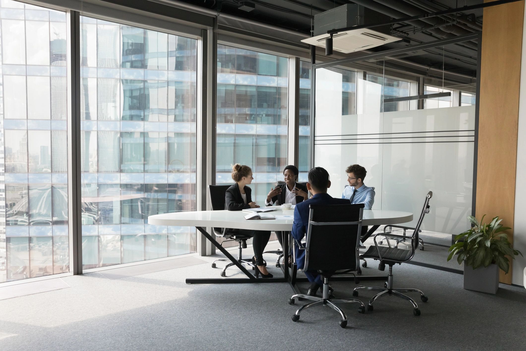 Technology consulting team meeting in a modern office
